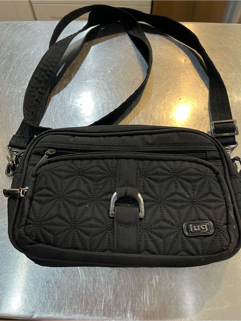 lug Black Quilted Crossbody Bag with Silver Accent
